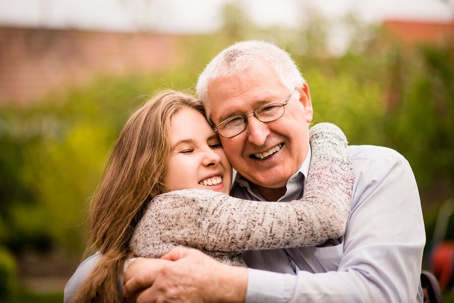 Grandfather and grandchild hug